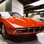 REFLX LAB 640T sample photo: red vintage Maserati under tungsten museum lighting