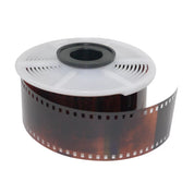AP developing reel loaded with 35mm film showing spiral groove pattern for auto-load film development