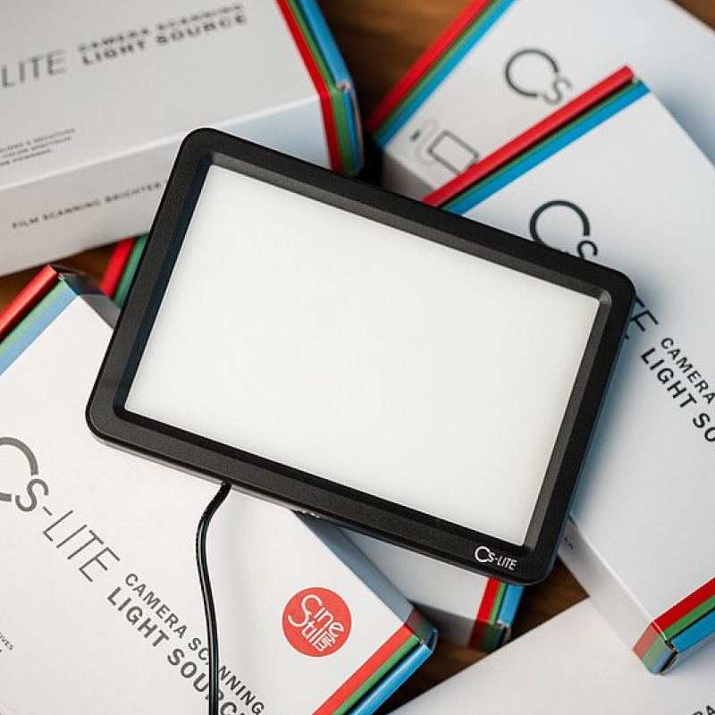 Cinestill CS-LITE LED light source illuminated on product box showing even diffused backlight for film scanning