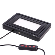 Cinestill CS-LITE with film format masks stacked and wired remote control showing brightness adjustment buttons