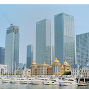 Fortuna C200 110 daylight sample photo: Macau marina skyline with skyscrapers, casino domes, and yachts