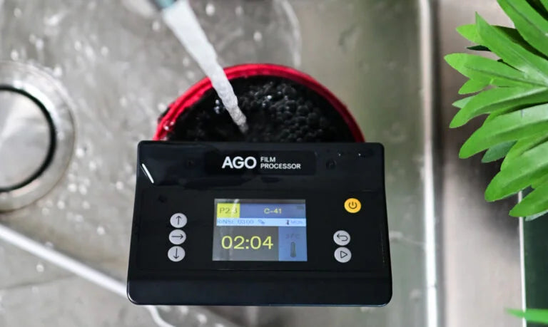 Developed black and white film negatives hanging to dry after home processing — ready for scanning or darkroom printing