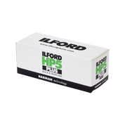 Ilford HP5 Plus medium format 120 film box and roll showing ISO 400 black and white film by Harman Technology