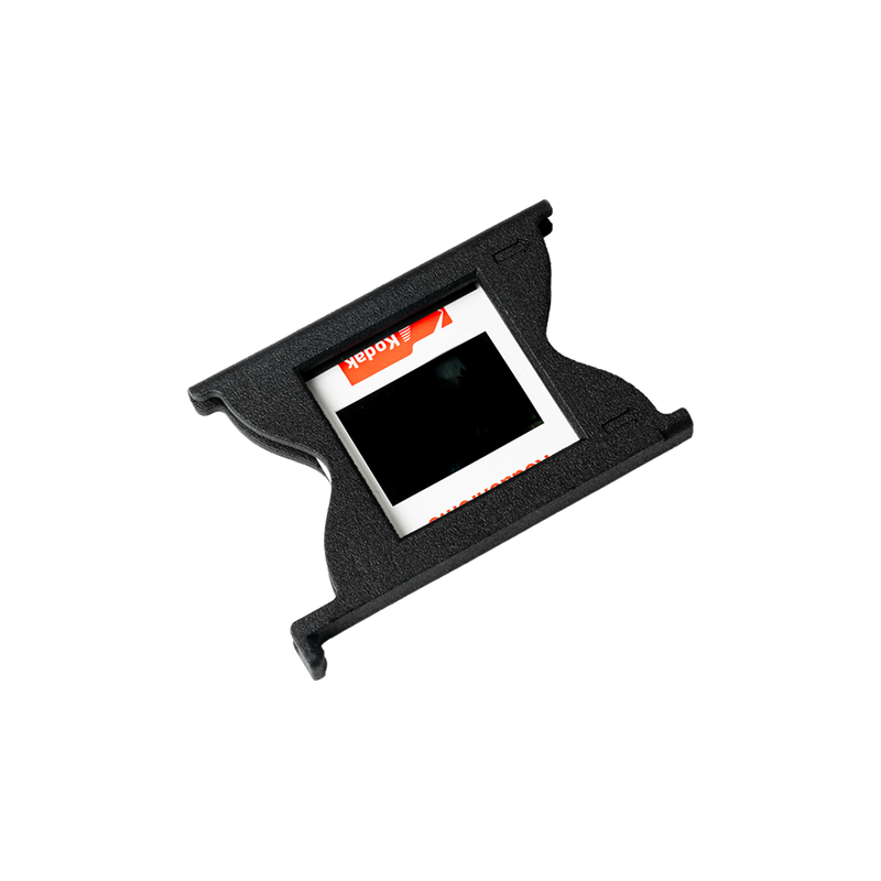 Easy35 Slide Holder with mounted 35mm slide inserted showing spring-loaded alignment for 50x50mm slide scanning
