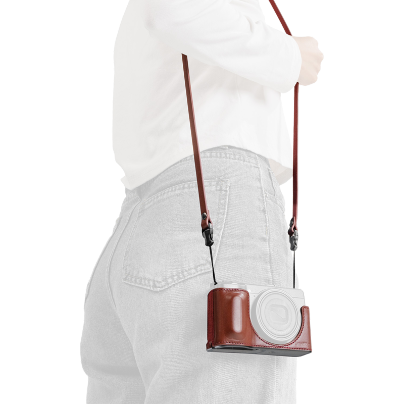 SmallRig quick release leather strap in red, worn over the shoulder, second view