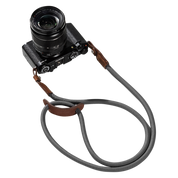 SmallRig braided shoulder strap in gray with brown leather ends on a camera