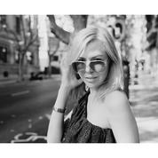 Sample image for ADOX HR-50: black and white portrait of a woman in sunglasses on a street