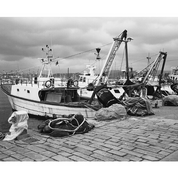 Sample image for ADOX HR-50: black and white photo of fishing boats on a cobbled quay