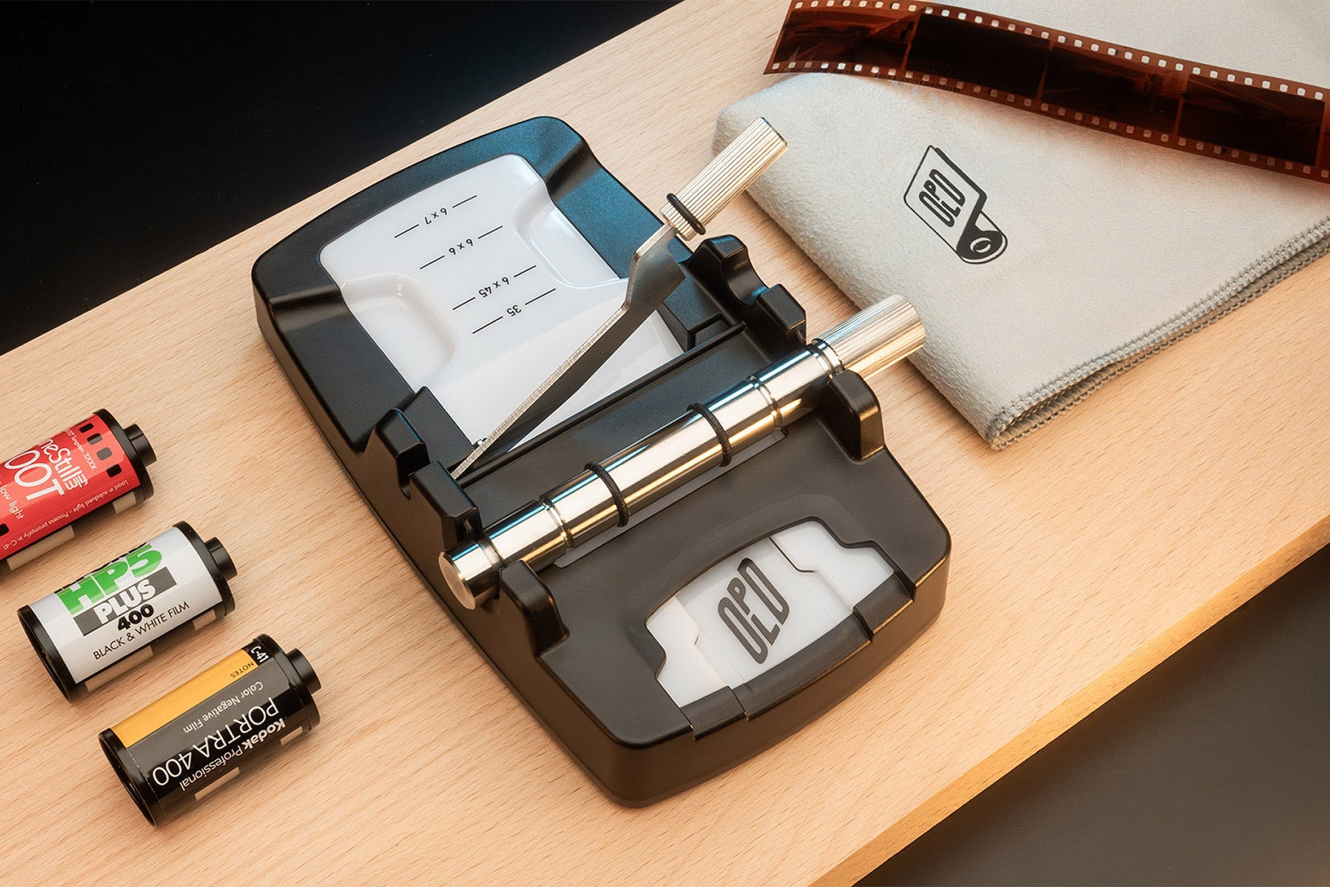 Optik Oldschool Film Killer film cutter on table top view