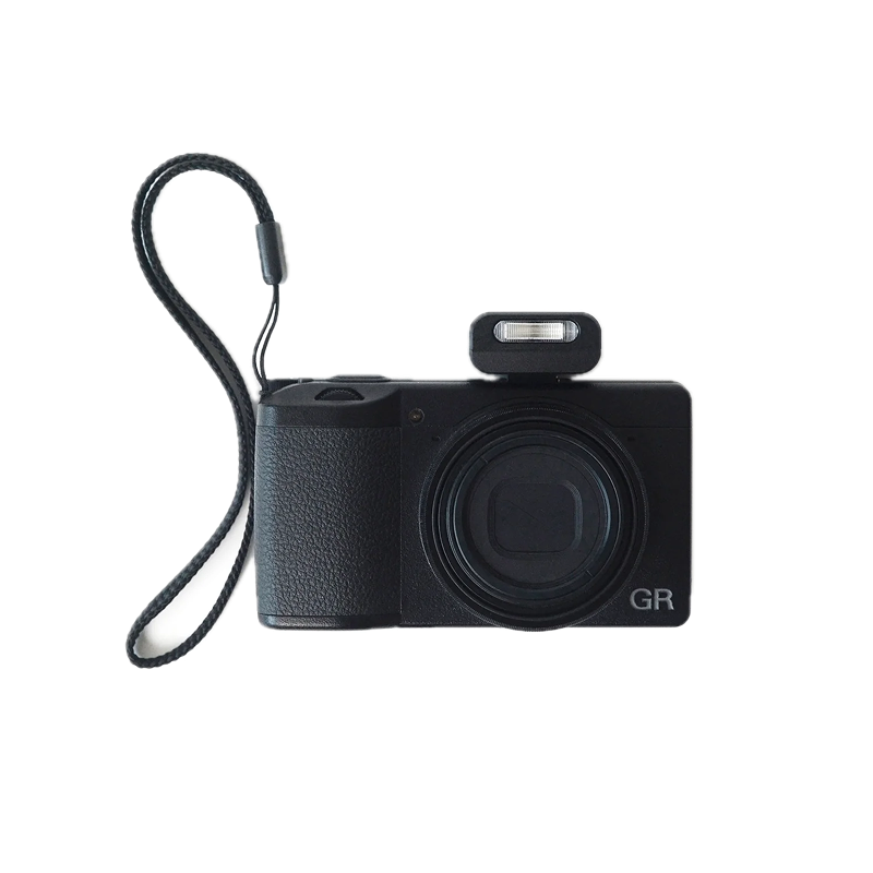 Black camera with strap on a white background reflx lab mini flash gen 2 mounted